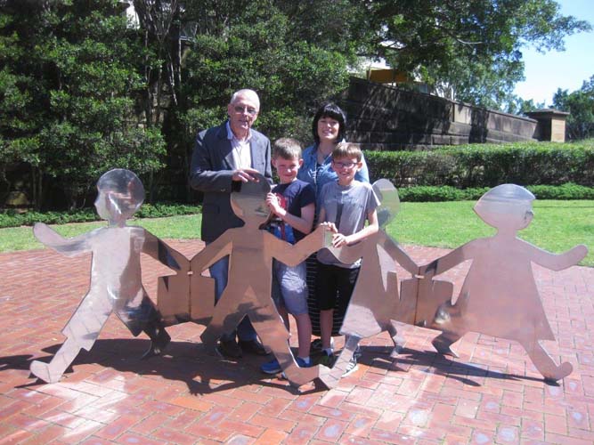 Jim Stone, his daughter Penelope and grandsons Liam and Ryan at the Sydney memorial to British child migrants, Coming and Going, at the ANMM, 2015. Photographer Kim Tao/ANMM.