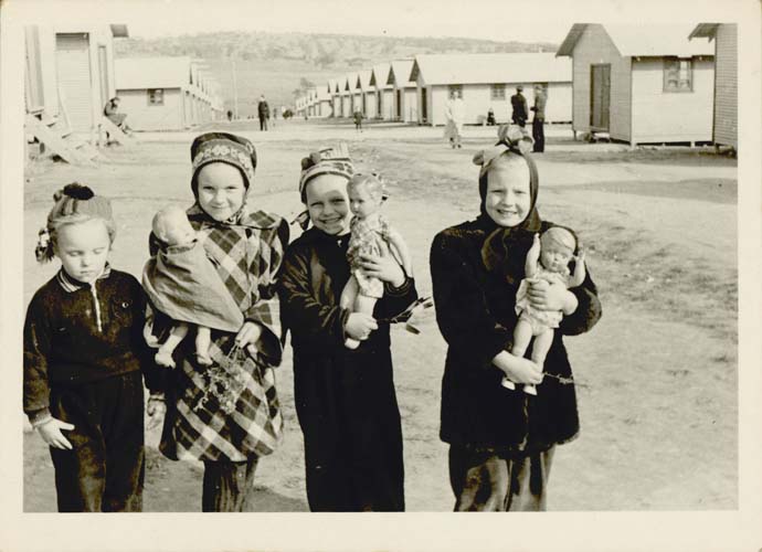 Maie Talmet (second from left) at Woodside Hostel with the doll her father gave her on arrival in Adelaide, 1949. Reproduced courtesy Maie Barrow.