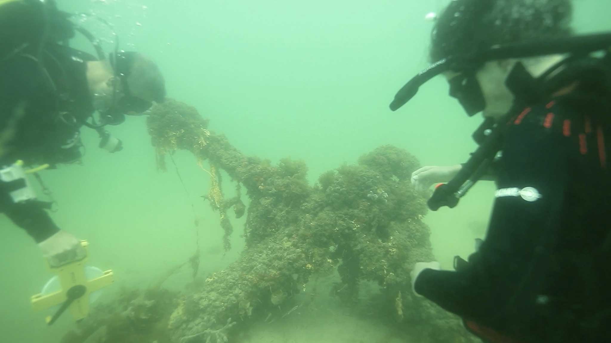 Leo examining an anchor with Dr James Hunter